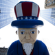 In this Nov. 28, 2013, file photo, a giant Uncle Sam balloon is marched down Sixth Avenue during the 87th Annual Macy's Thanksgiving Day Parade in New York. Helium makes the huge balloons in the parade sail high above the crowd. (AP Photo/John Minchillo)